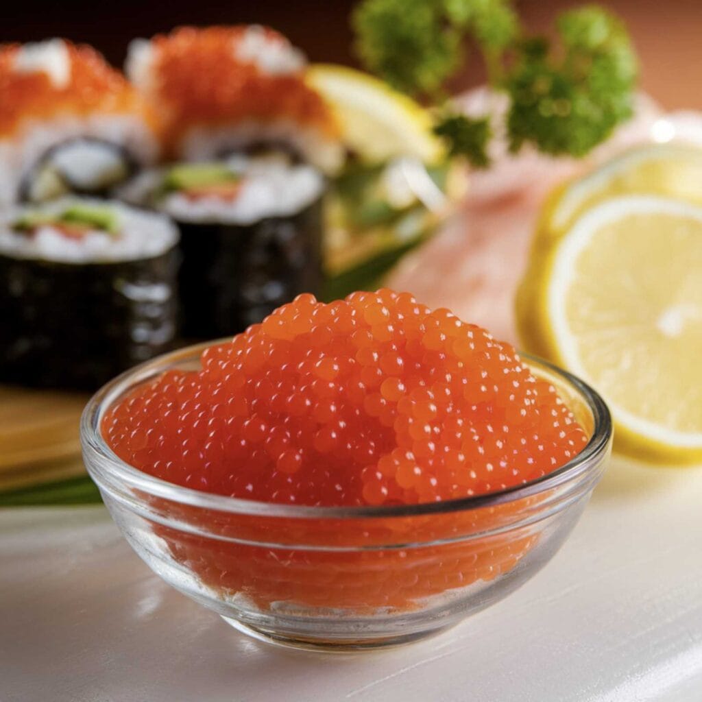 Bright orange masago roe beautifully garnishing sushi rolls.